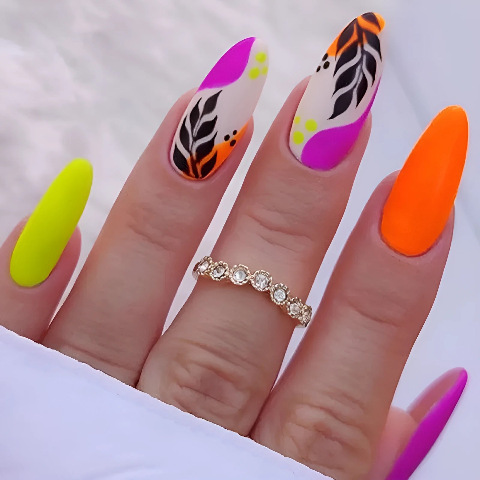 Wear Armour frosted nail stickers in four patterns: French colourful leaves, star flash macarons, leopard print, and colourful plating.