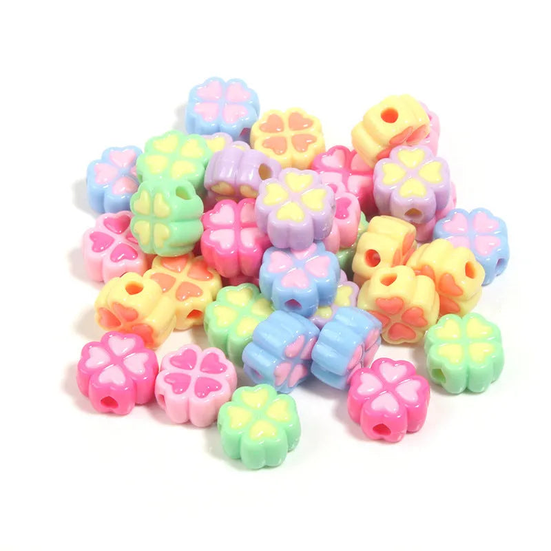 Acrylic clover craft beads with frosted finish in mixed colours including pink, blue and green