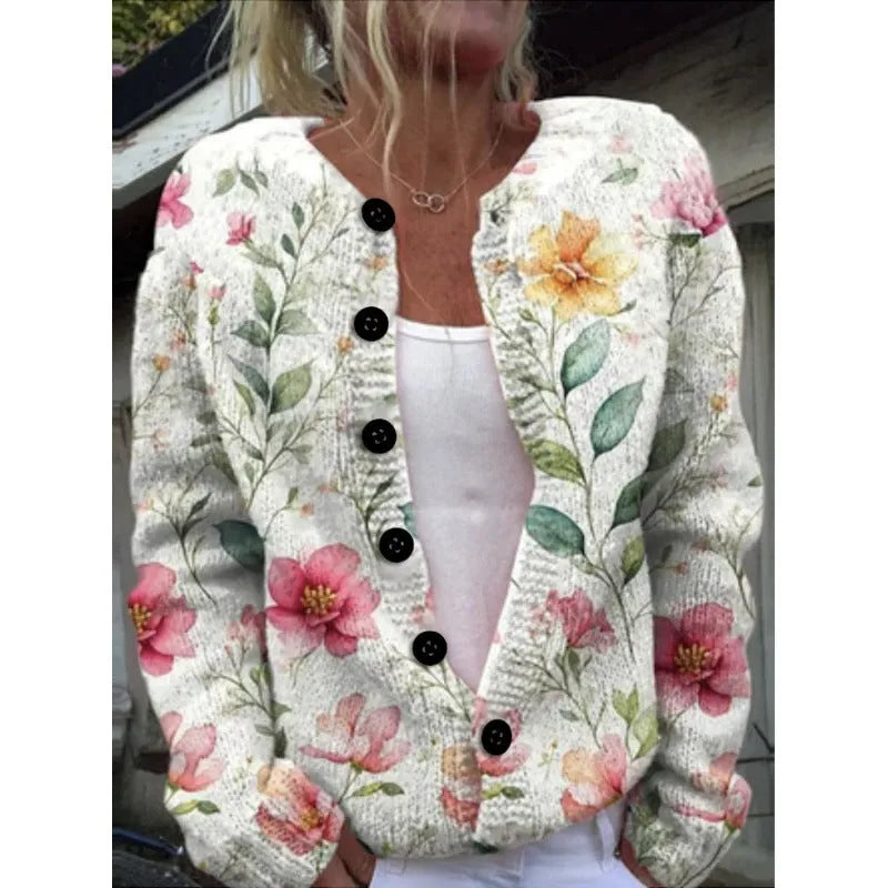 Yellow digital print cardigan knit coat with a raised 3D pattern on a hanger.