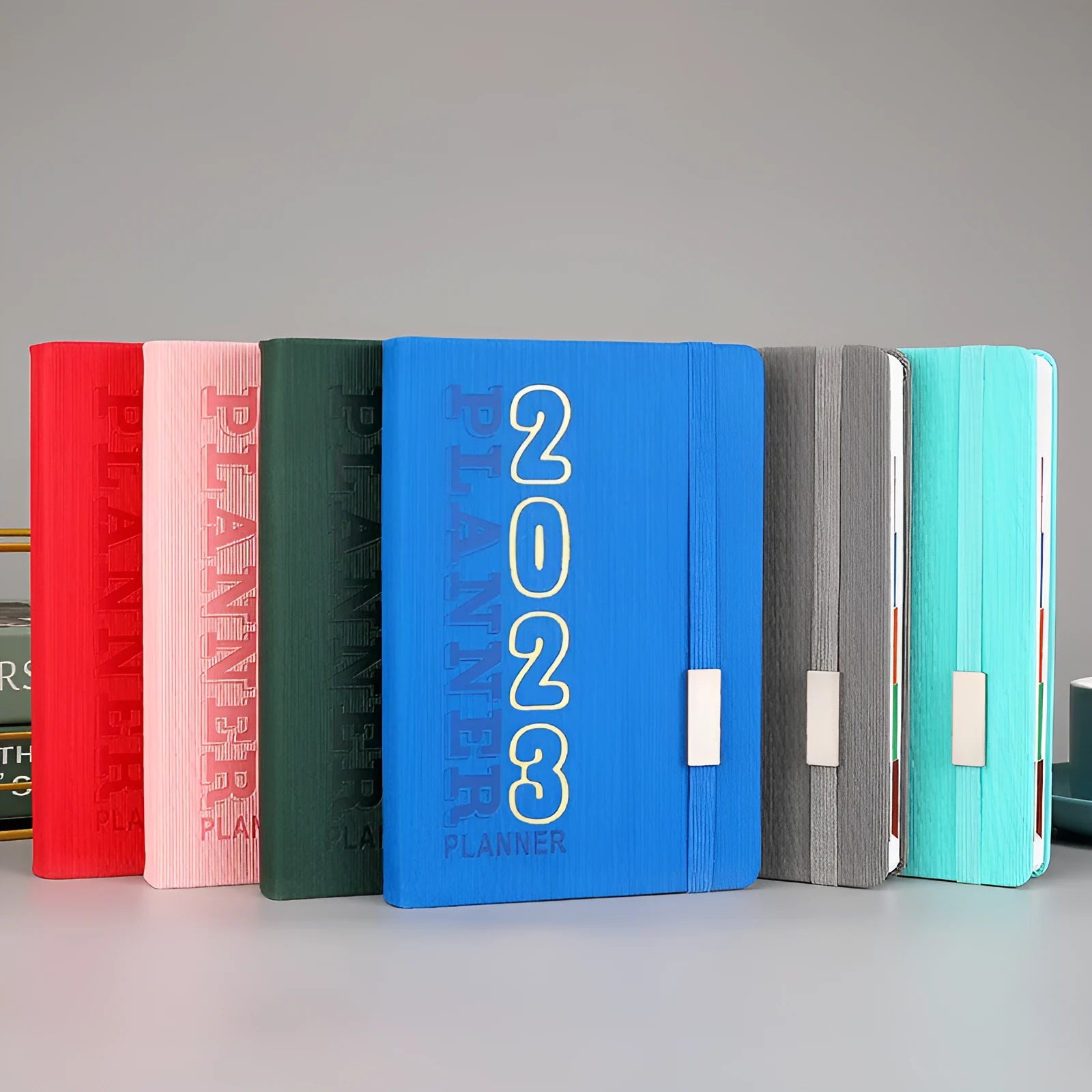 Creative student diary planner with imitation leather cover, open to show wire-o binding and calendar layout.