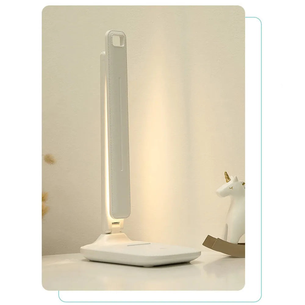 White plastic LED table lamp with touch dimming control and USB charging for children's bedroom use