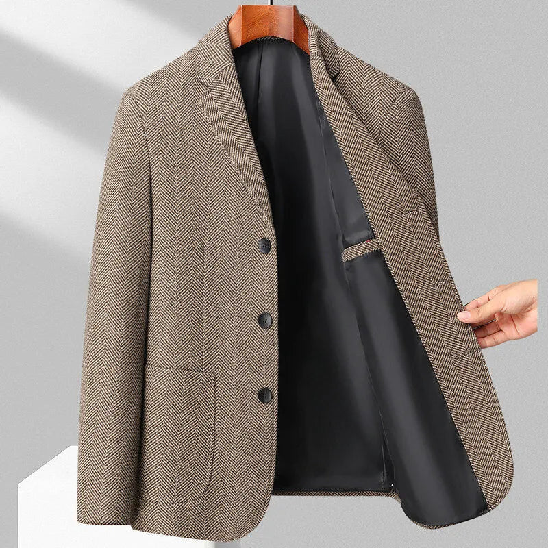 Man wearing a loose fit black woolen coat for casual spring or autumn leisure wear.