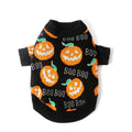 Black dog sweater with a large orange Halloween pumpkin pattern on the back, laid flat.