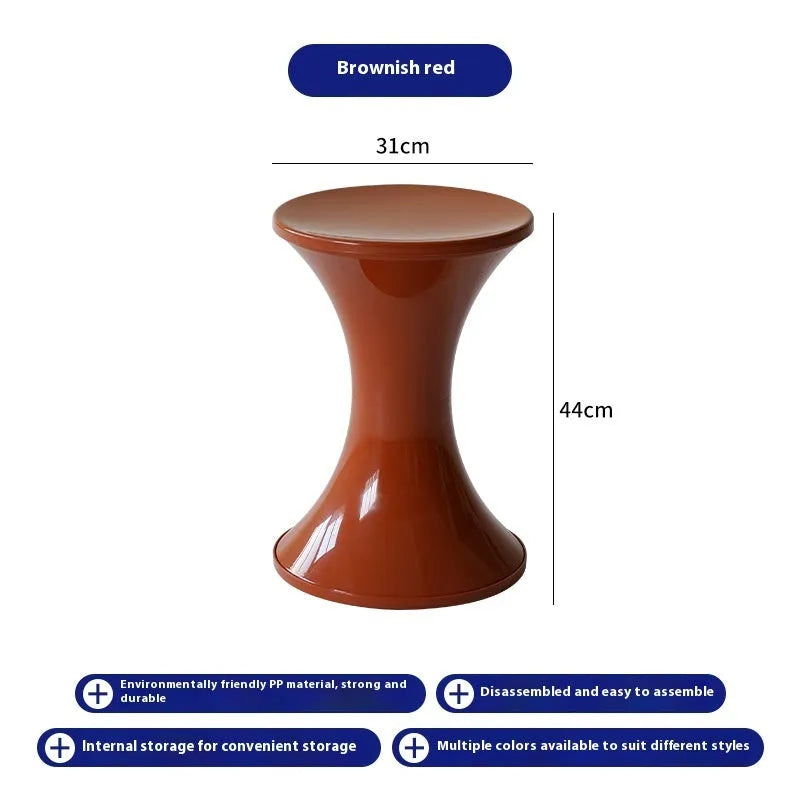 A plastic hourglass-style shoe changing stool in one of five available colours: black, green, red, white, or brown.
