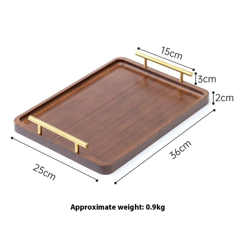 Square bamboo serving tray with brown handle on solid colour background