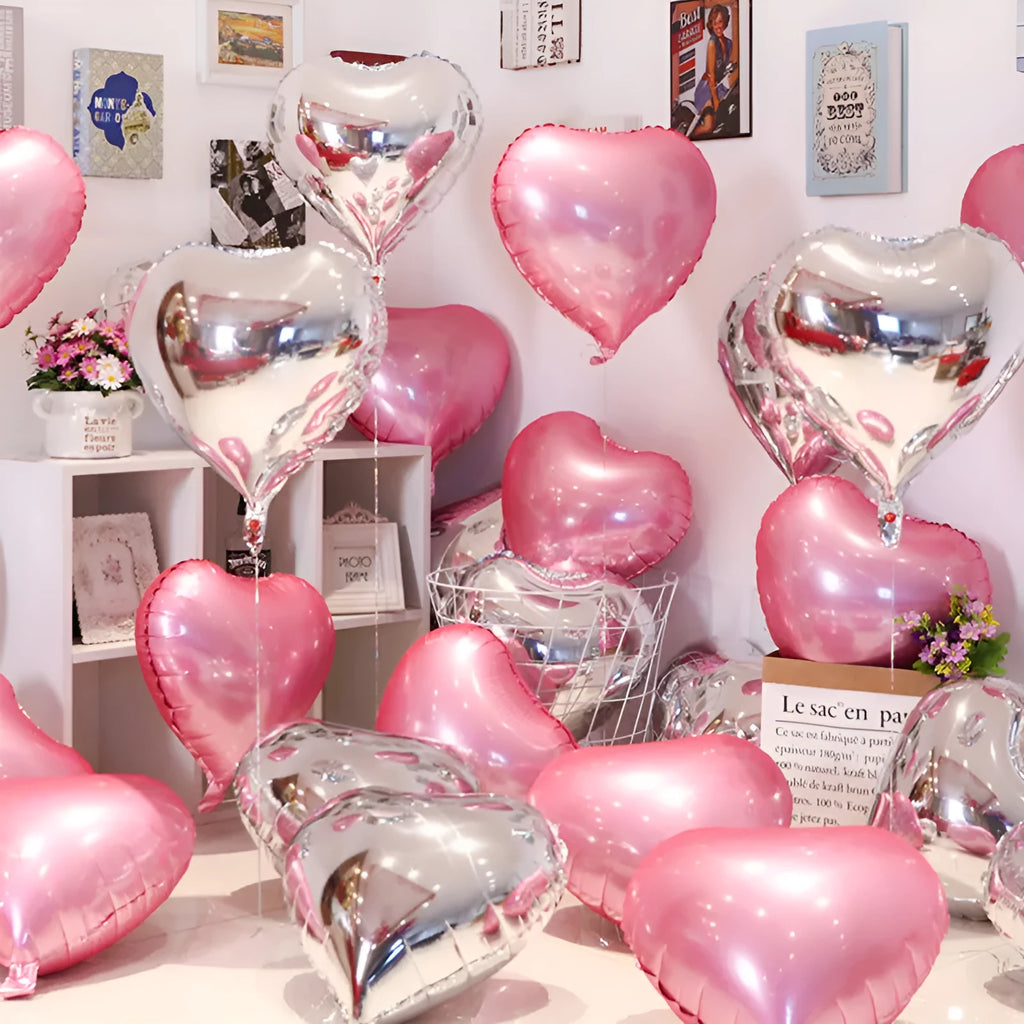 Five peach heart-shaped aluminium foil balloons in sparkling colours for party decoration