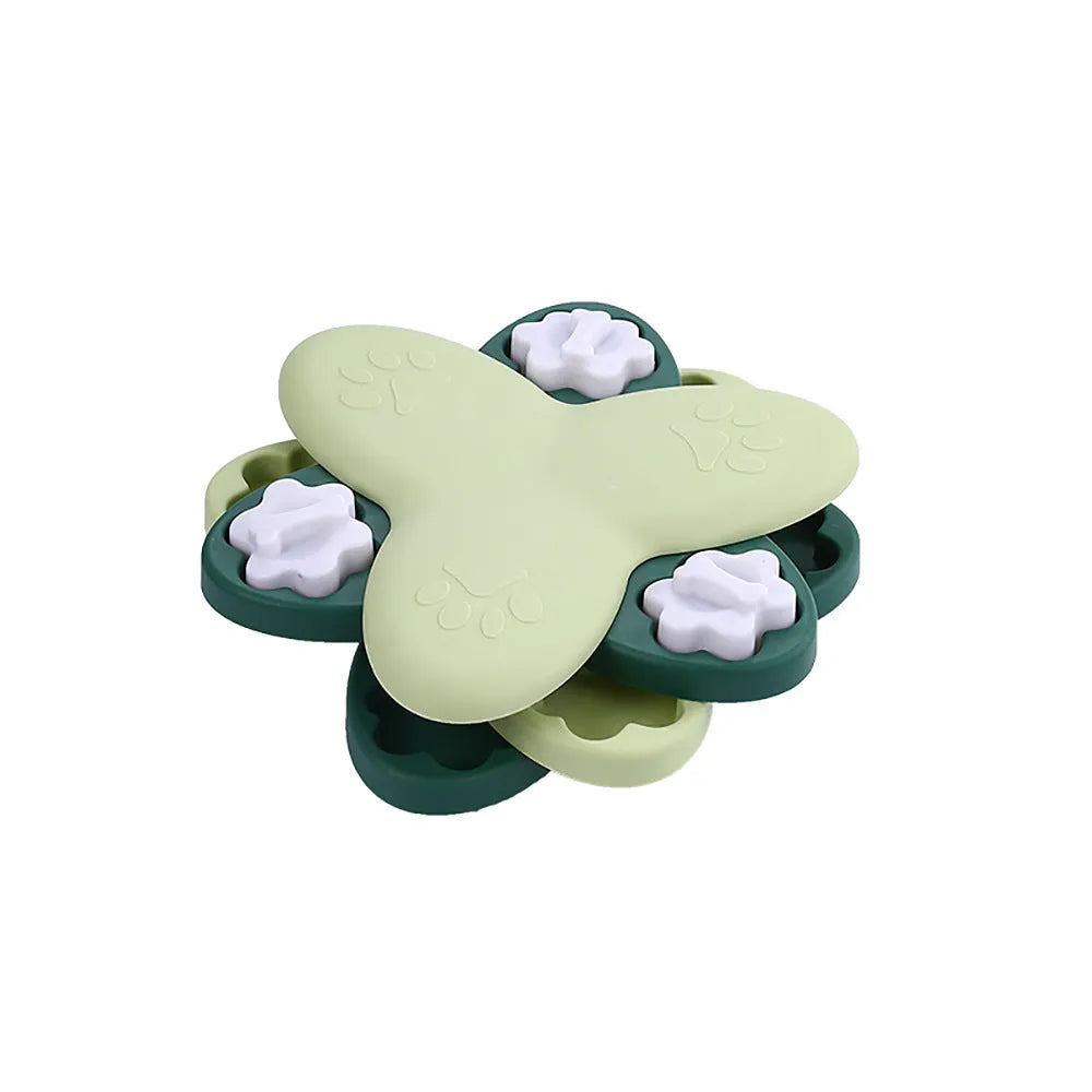 Green and yellow interactive dog puzzle toy with rotatable compartments and bone-shaped covers