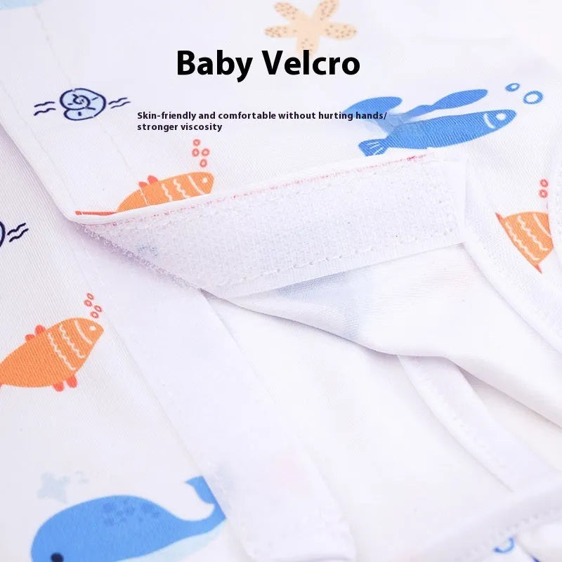Cat wearing a sterilisation recovery suit with Velcro fastening and a printed pattern design