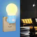 Plug-in bedside baby night feeding lamp in white, blue, or pink shell with round modern design