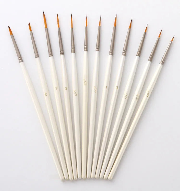 12 Pearl White artist brushes with nylon wool bristles and solid wood handles arranged by size.