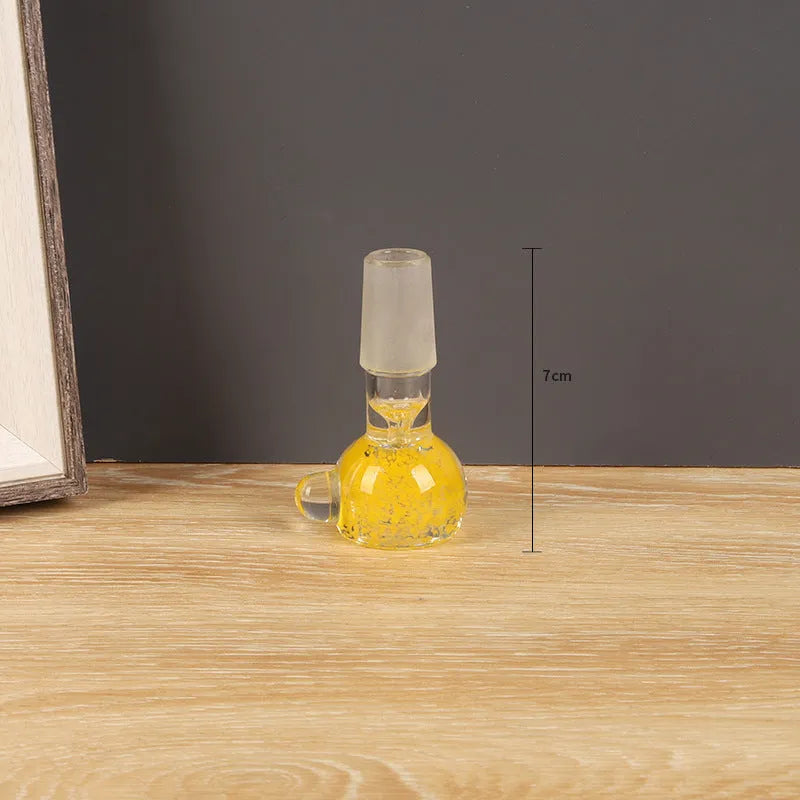 Transparent glass tobacco pipe in trumpet shape measuring 7cm, available in four colours