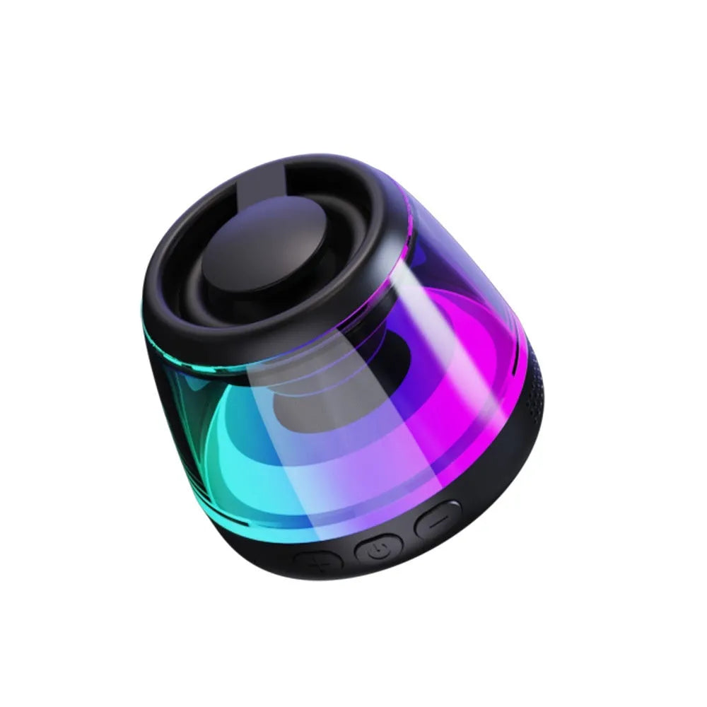 White portable Bluetooth speaker with magnetic base and ambient light on a metal surface.