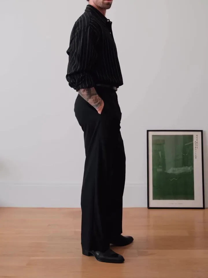 Black pinstriped button-down shirt with regular fit on a hanger