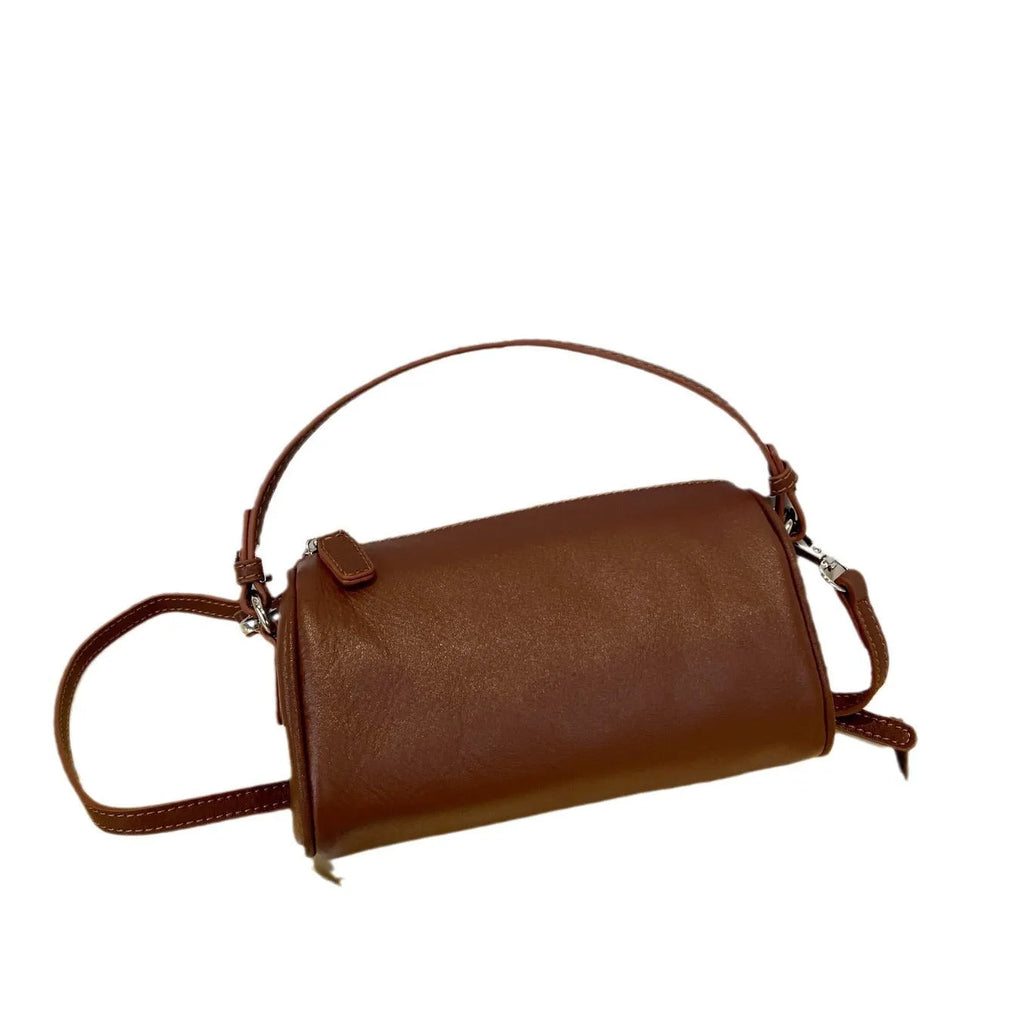 Genuine leather cylindrical crossbody bag for mobile phones in a street style, shown in brown.
