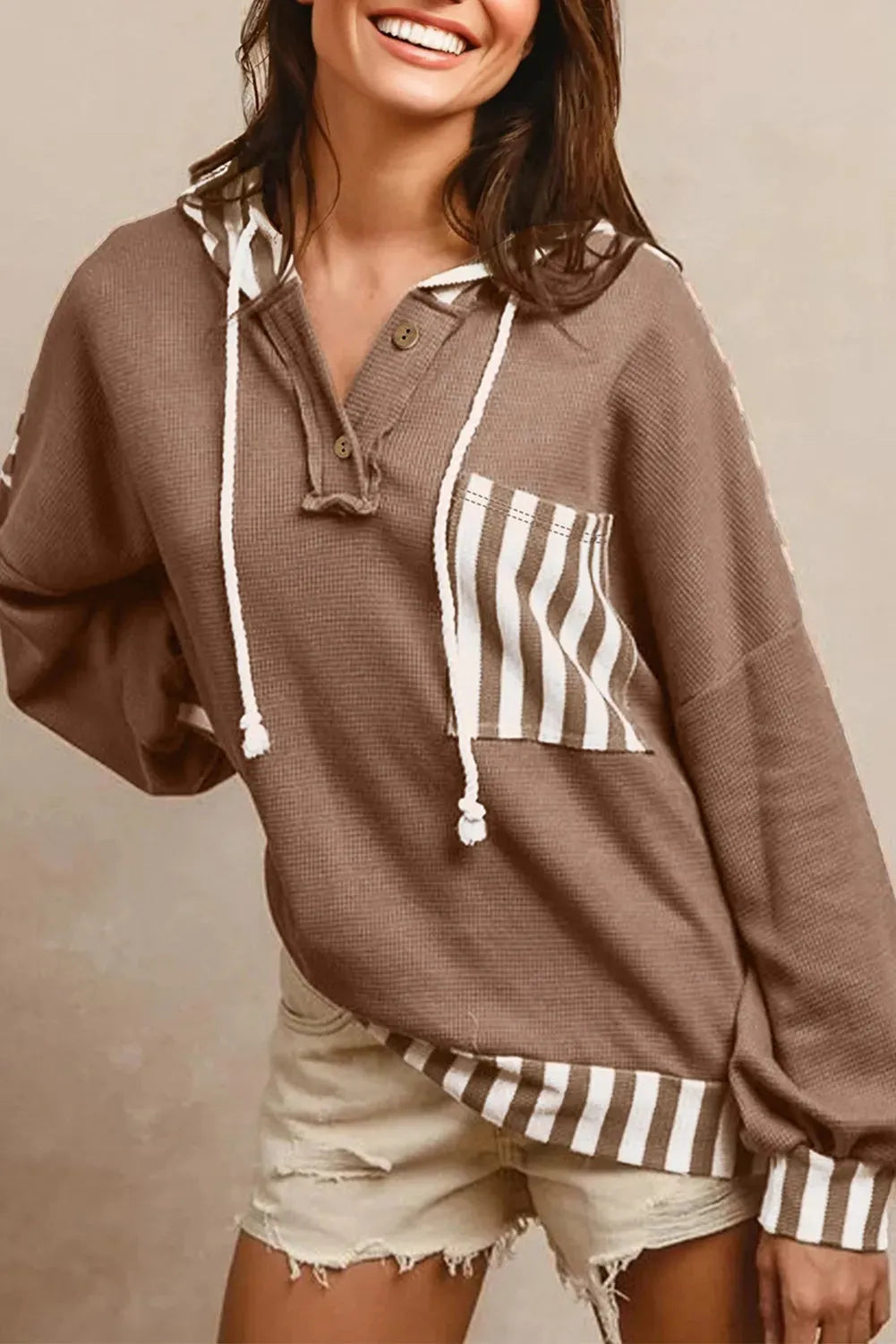 Straw yellow women's hoodie with waffle texture, striped patchwork, button neck, and drawstring waist.