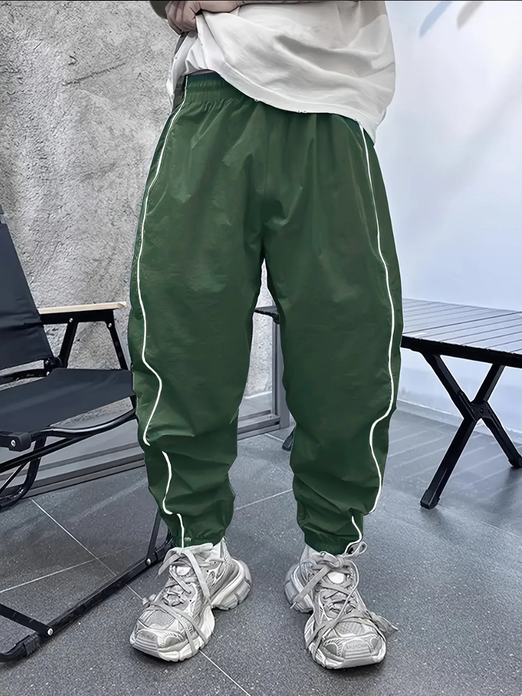 Men's blue bamboo fibre sports trousers with a loose, cropped fit and elastic waist.