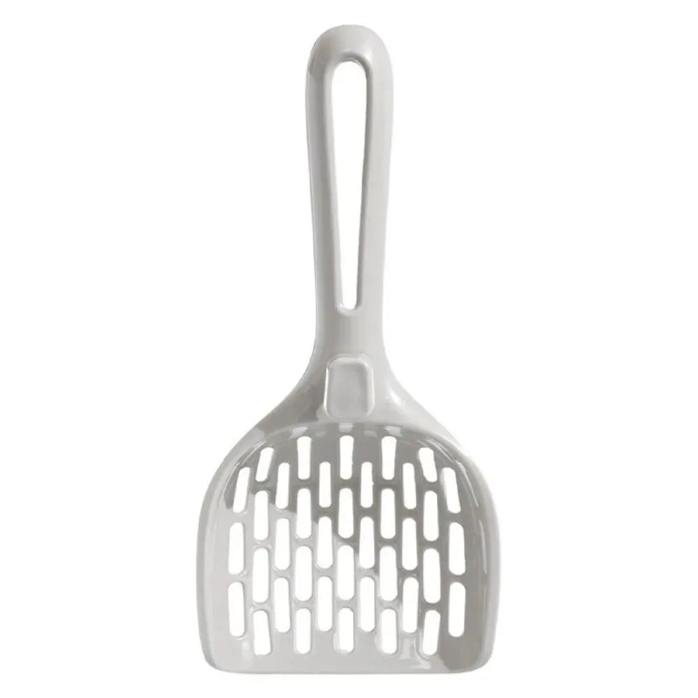 Grey plastic cat litter scoop with anti-slip handle sitting on its matching plastic base tray.