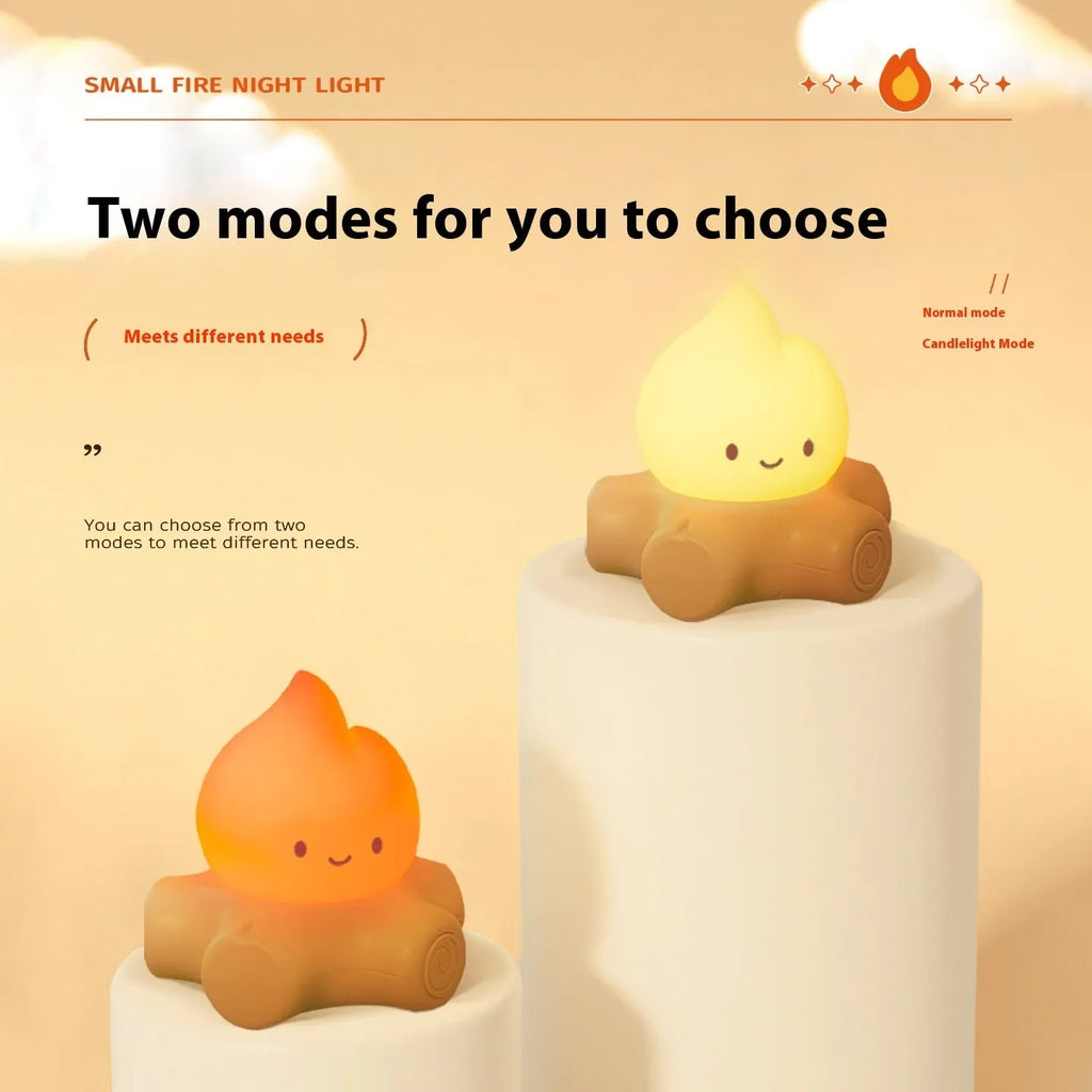 Silicone small fire pile cartoon night light on a surface, showing its yellow glow and compact size.