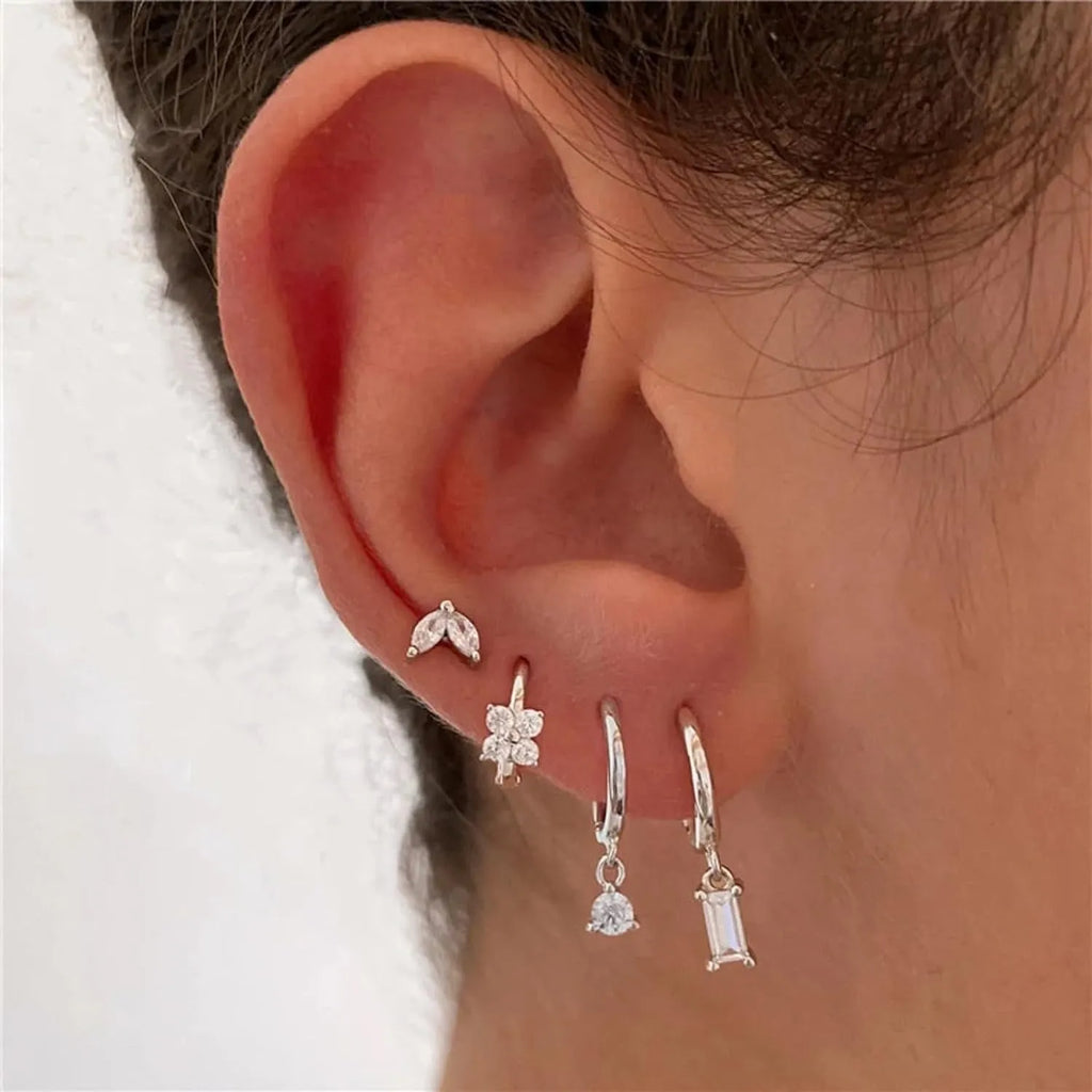 Geometric copper earrings with electroplated gold finish featuring star shapes and zircon detailing