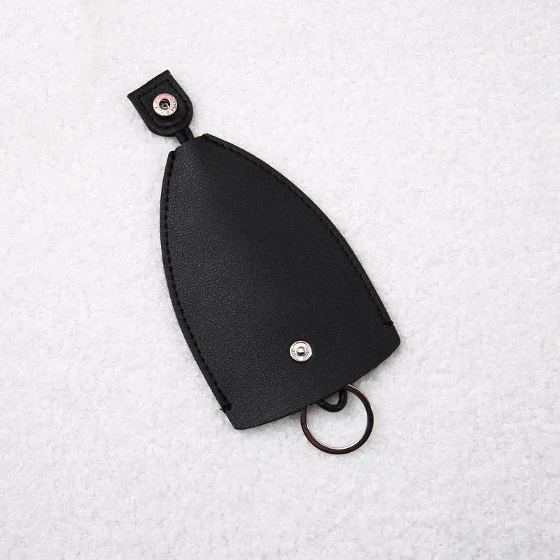 Colourful cartoon pull-out key case made from PU leather, showing the key extended from its protective sleeve.
