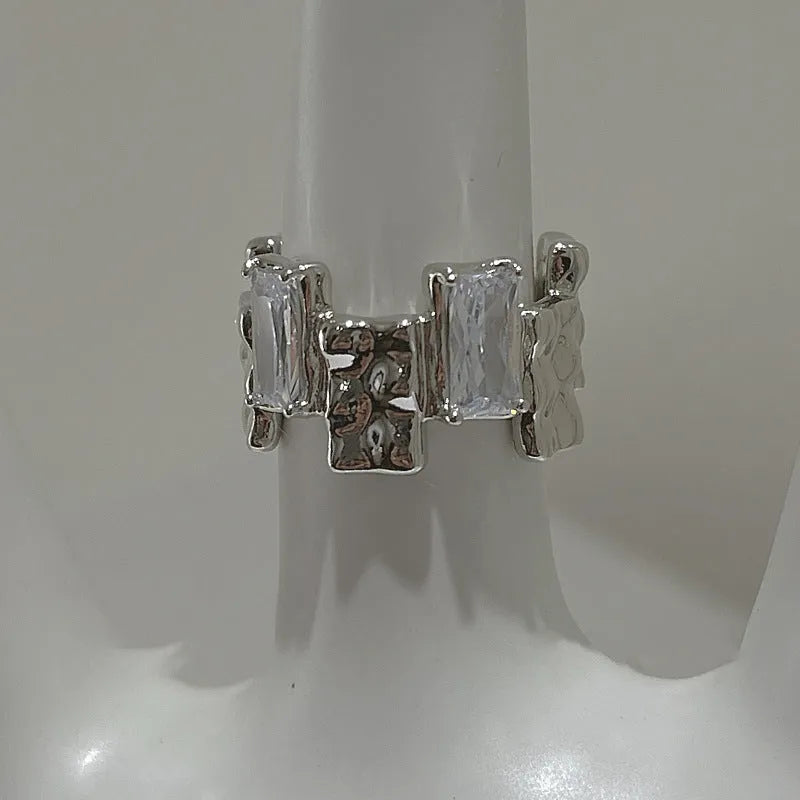 Geometric open silver ring with cross zircon gemstones and three-dimensional decoration