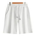 Men's straight leg cotton sports shorts in light grey on a hanger.
