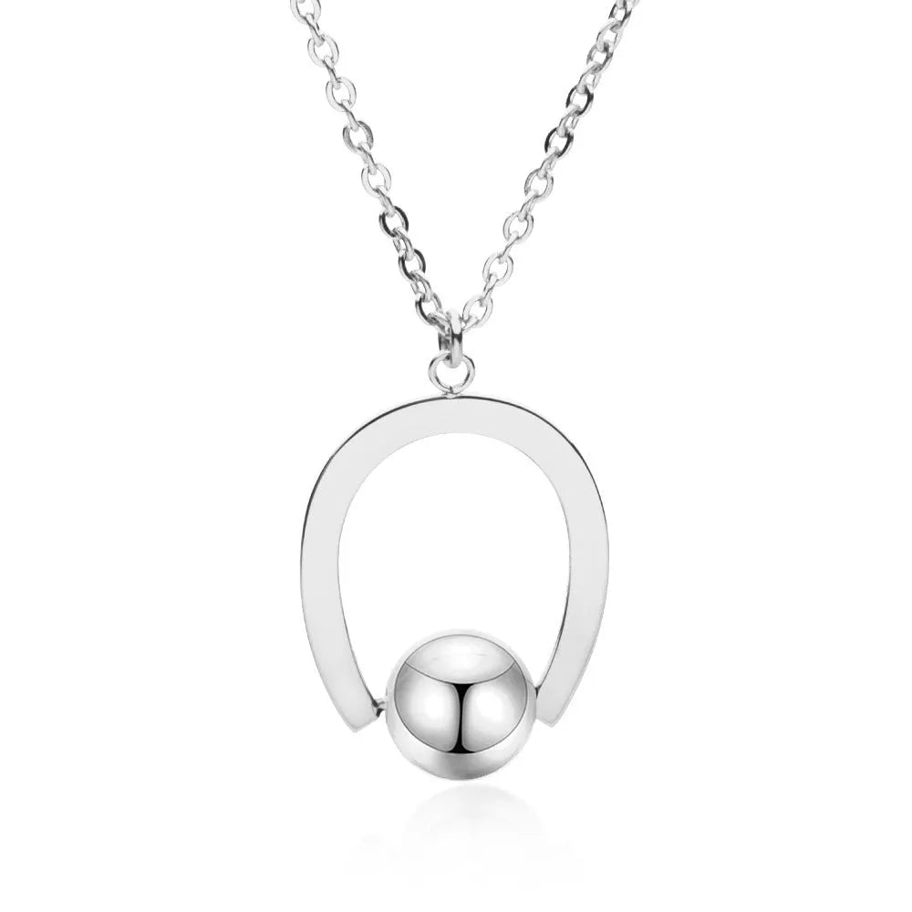 Gold or silver geometric stainless steel necklace on an adjustable cross chain.
