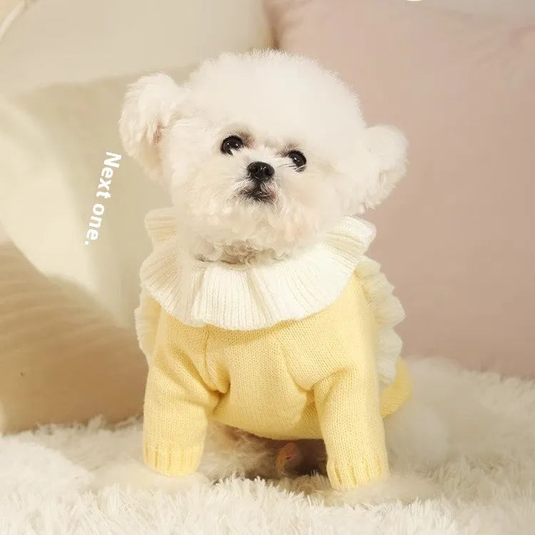 Yellow acrylic puppy sweater for small dog on size guide showing XS S M L XL chest measurements.