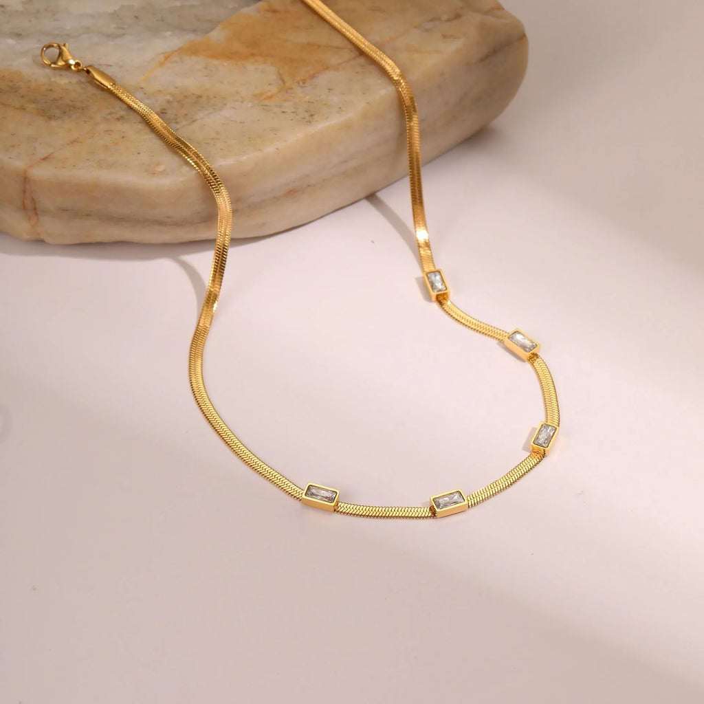 Retro geometric square zircon necklace on flat snake-style stainless steel chain in gold finish