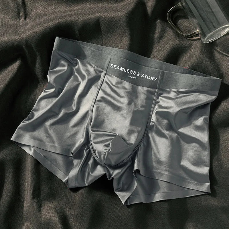 Men's solid colour ice silk boxer shorts on a mid-waist, showing satin knit fabric.