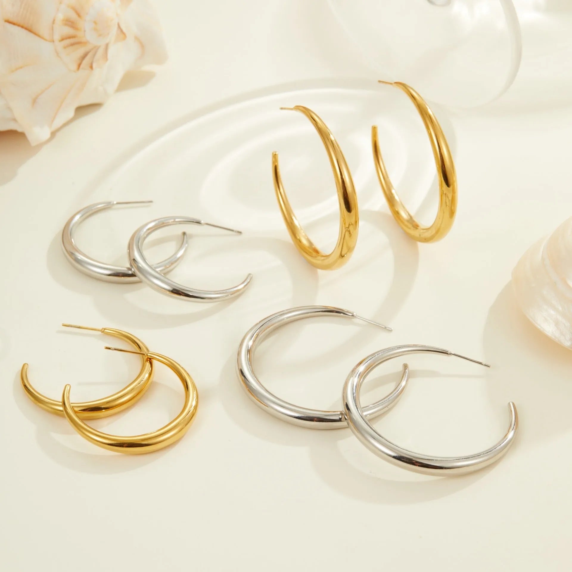 Titanium steel geometric hoop earrings with 18K gold plating in large and small sizes