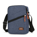 Lightweight solid colour oxford cloth crossbody commuter bag in black, navy, or silver grey.
