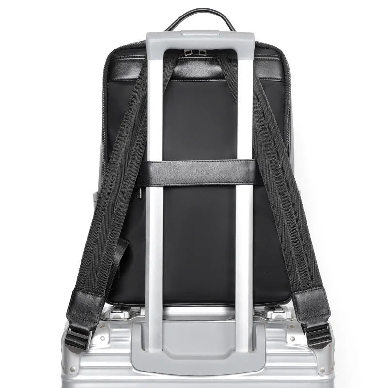 Men's black leather computer backpack with 36-55L capacity and physiological curve back plate