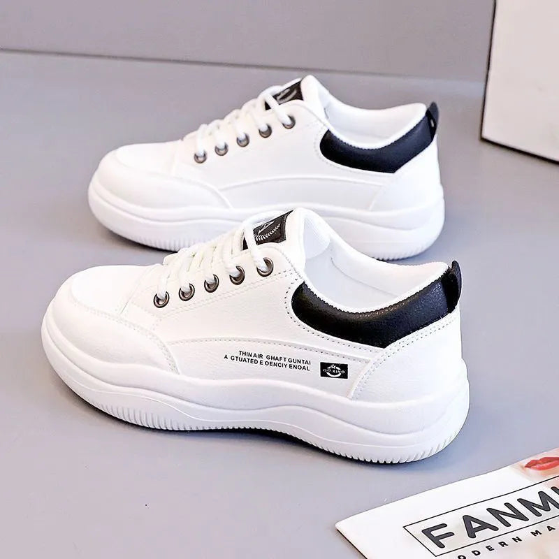 Women's white Korean style low top pumps with round head, cross straps, and rubber sole