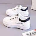Women's white Korean style low top pumps with round head, cross straps, and rubber sole