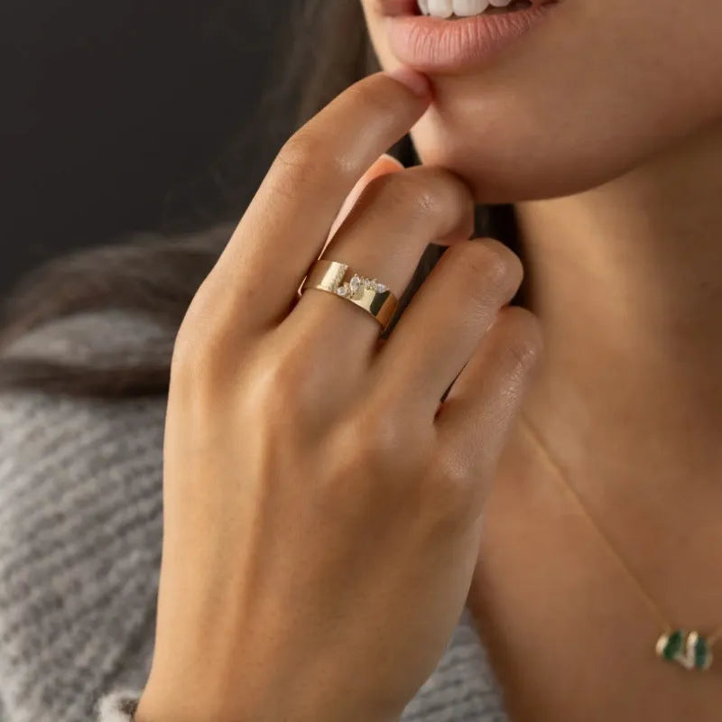 Gold colour zircon ring with electroplated finish on copper base, available in UK sizes 6-10