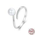 Adjustable open loop sterling silver ring with natural shell pearl in 8 US sizing