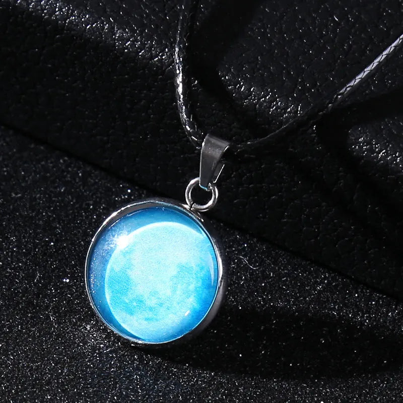Luminous moon and constellation pendant necklace on a chain with an extension, shown in one of ten possible colours.