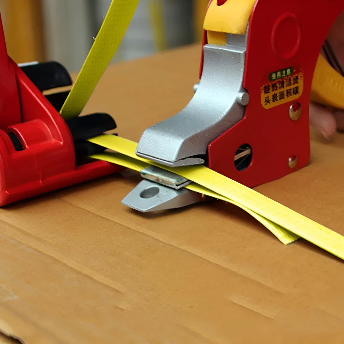 Electric hot melt packing machine kit with yellow tape and plastic steel tensioner, showing UK plug.