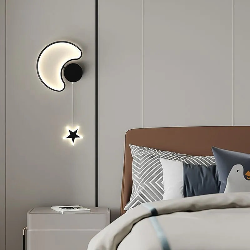 Cartoon cloud, moon and five-pointed star shaped bedside wall lamp for a children's bedroom in black or white.