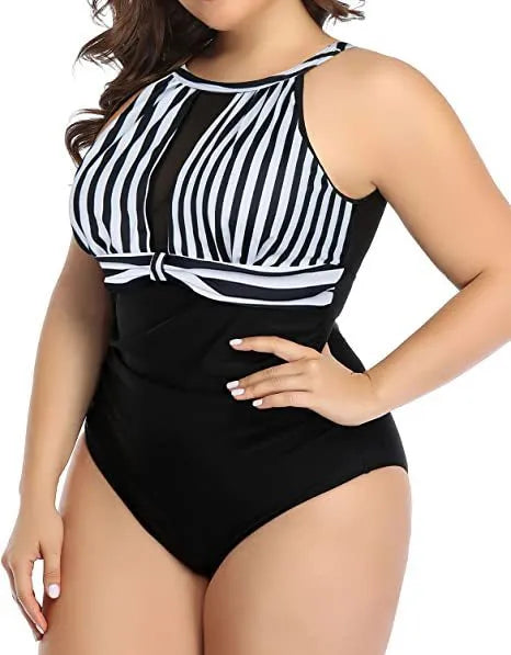 Women's black lace-trimmed one-piece swimsuit on a hanger