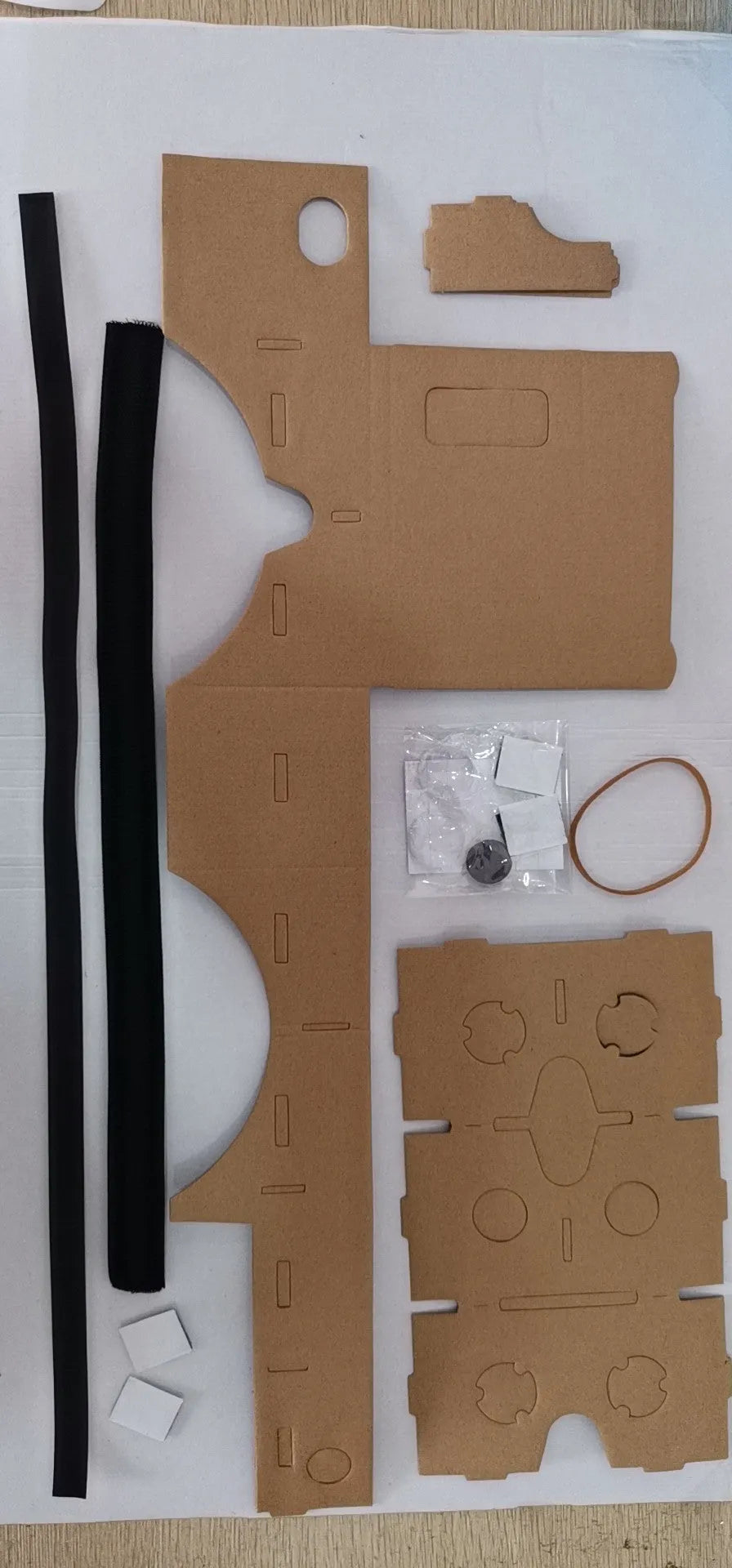 Pink and white cardboard VR glasses for smartphones with adjustable head strap and 3D lenses