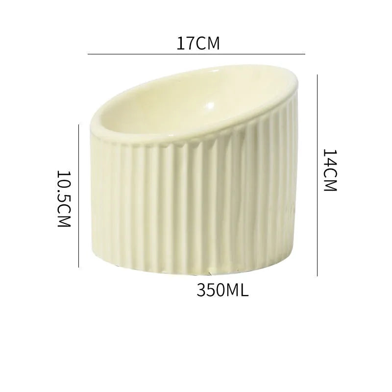 Ceramic elevated cat bowl in green colour, showing tilted design and raised feeding height.