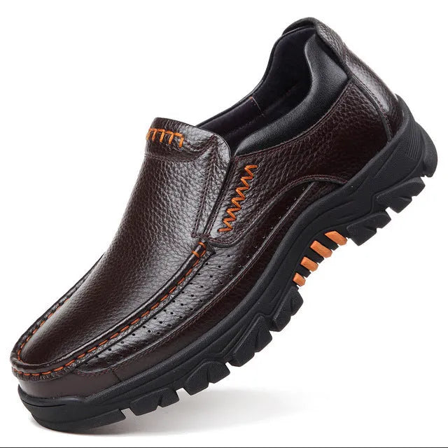 Business casual leather slip-on shoes in black and brown colours showing rubber sole and professional design