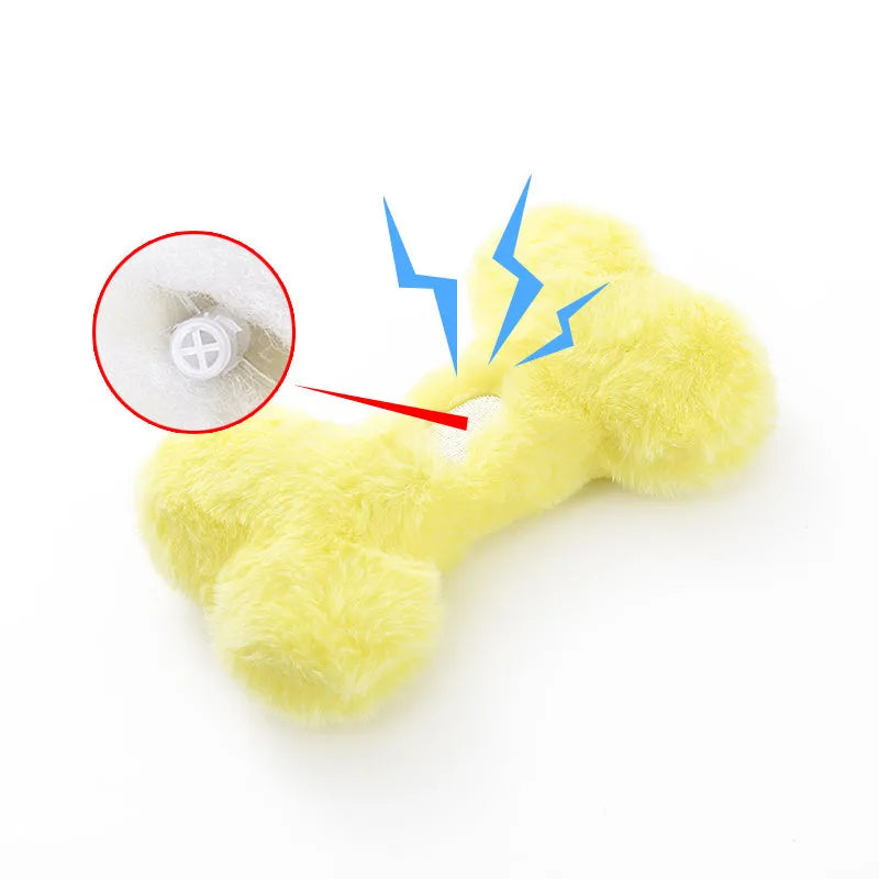 Blue, pink and yellow bone-shaped plush dog toys with squeaker for interactive play