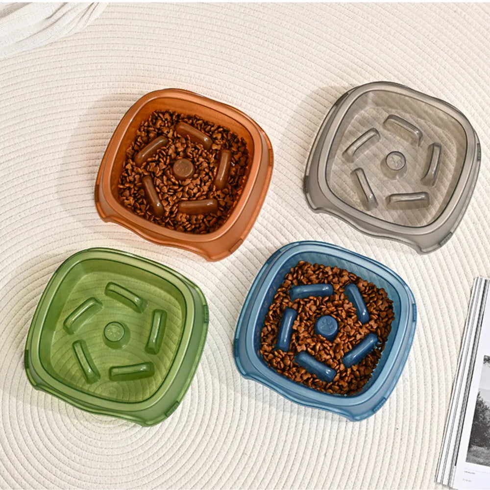Blue plastic dog slow feeder bowl with anti-choking design on a white background