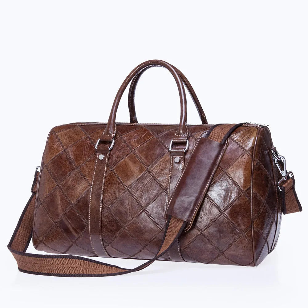 Vintage brown cowhide leather men's duffel bag with a single shoulder strap, shown open to reveal internal organiser pockets.