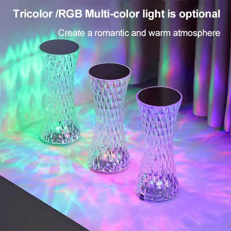 Vase-shaped crystal table lamp with LED lights and remote control on wooden bedside table
