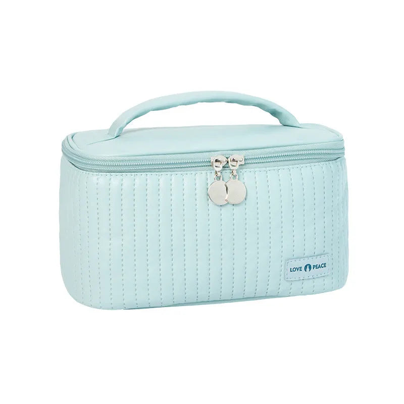 Open-top PU leather makeup bag in a choice of six solid colours.