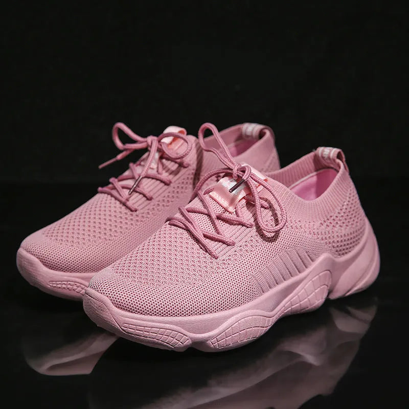 Women's white thick-soled sports shoes with woven mesh upper and front adjustable strap.